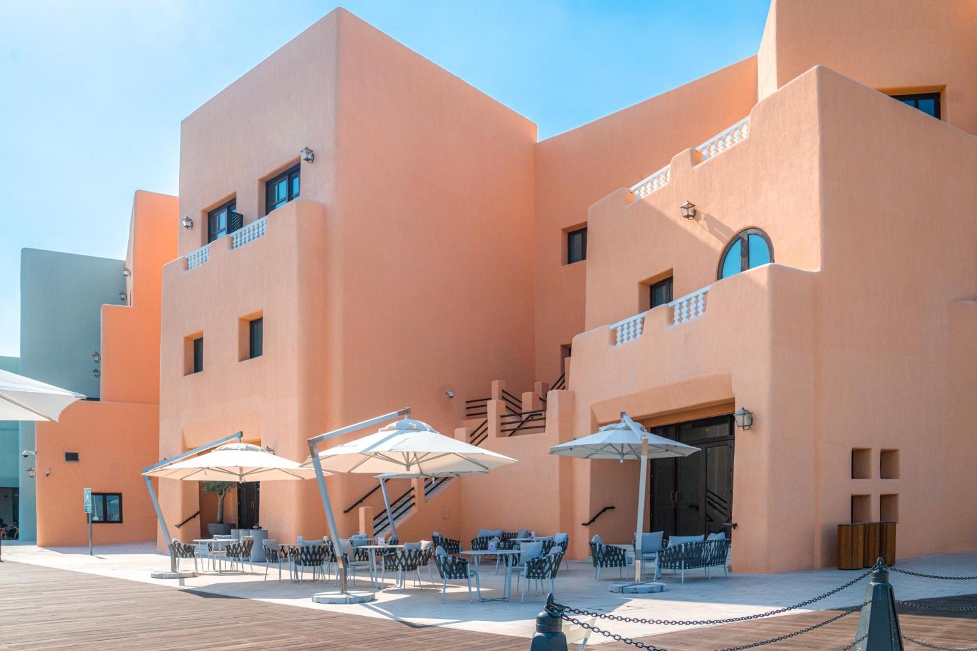 Mina Hotel And Residences By The Torch Doha Ngoại thất bức ảnh The hotel's main building